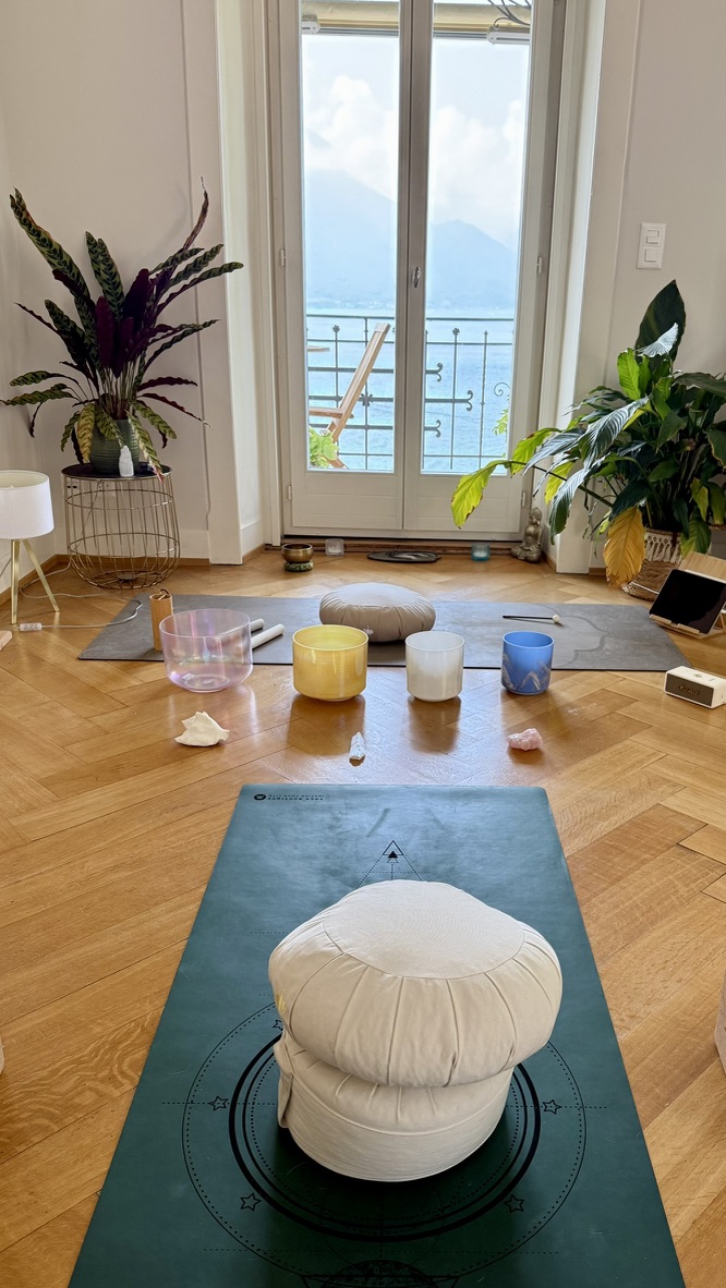 Breathwork setup with crystal bowls facing Lake Geneva at Maison Riviera